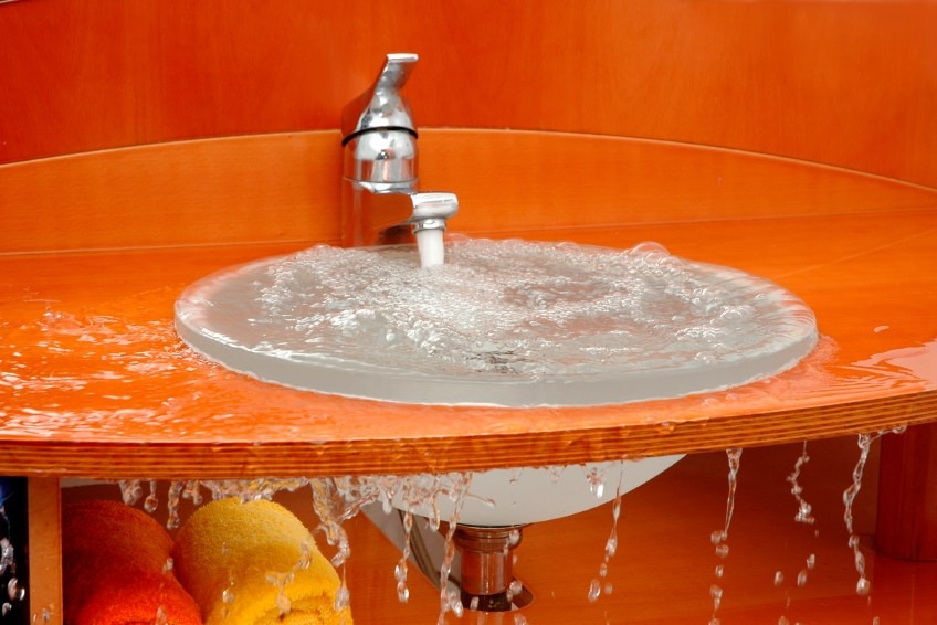 bathroom sink clogged full of water