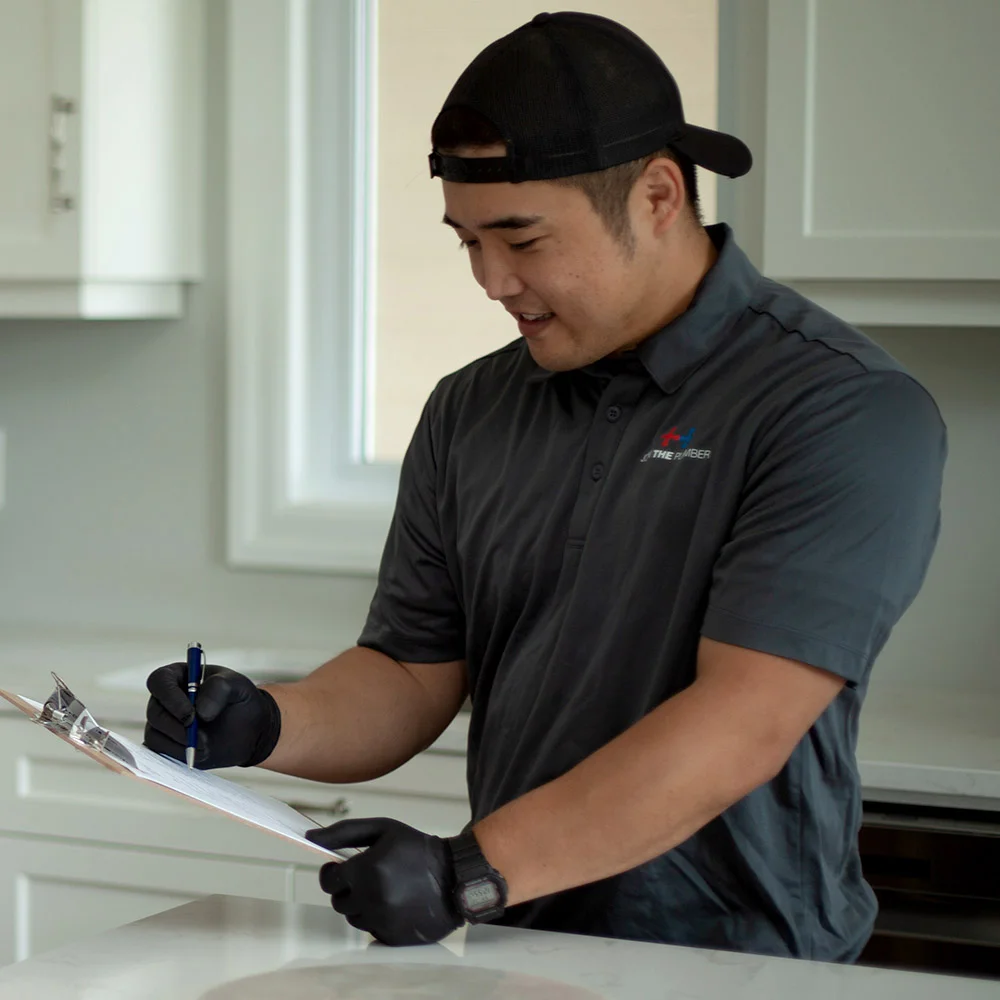 burlington plumber performing plumbing inspection