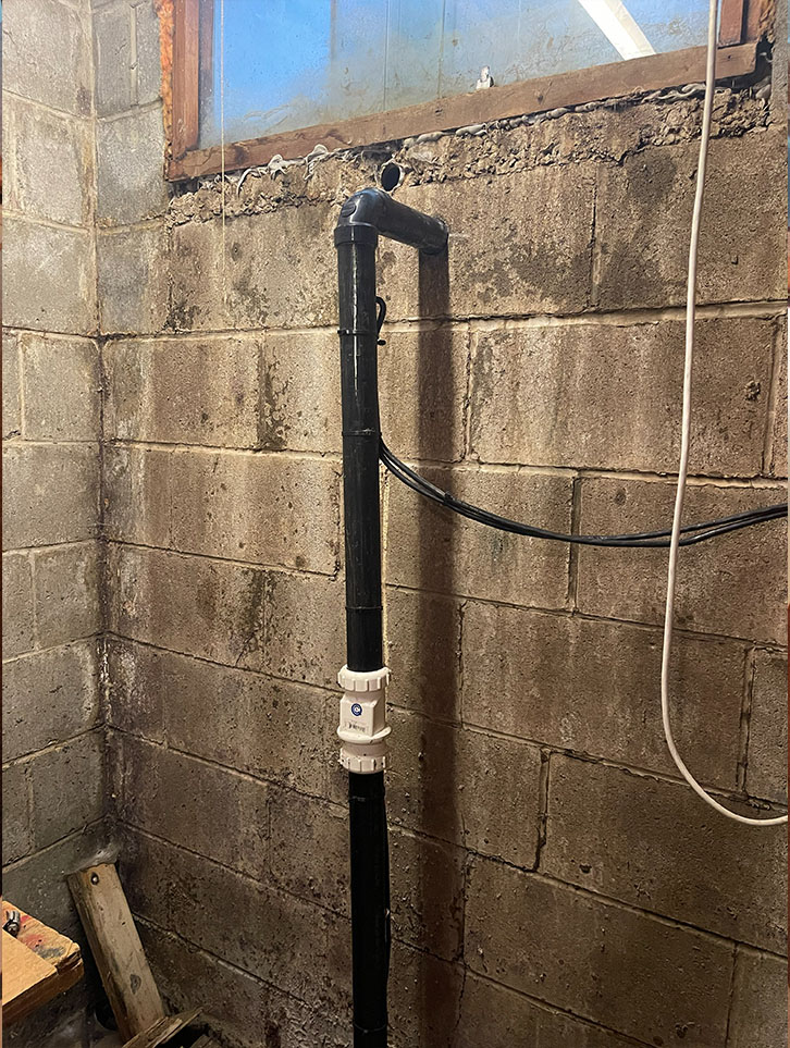 Indoor sump pump discharge piping in an Ottawa home