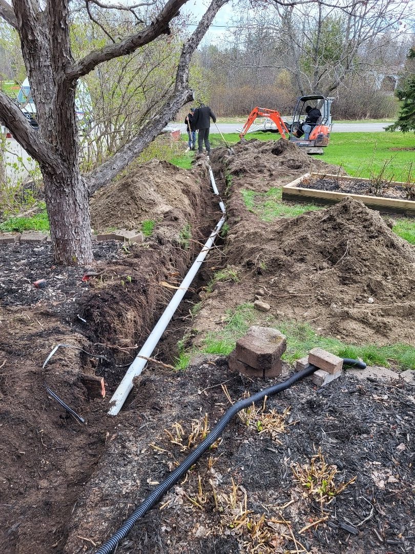 Exterior sump pump discharge trench and line installation in Ottawa