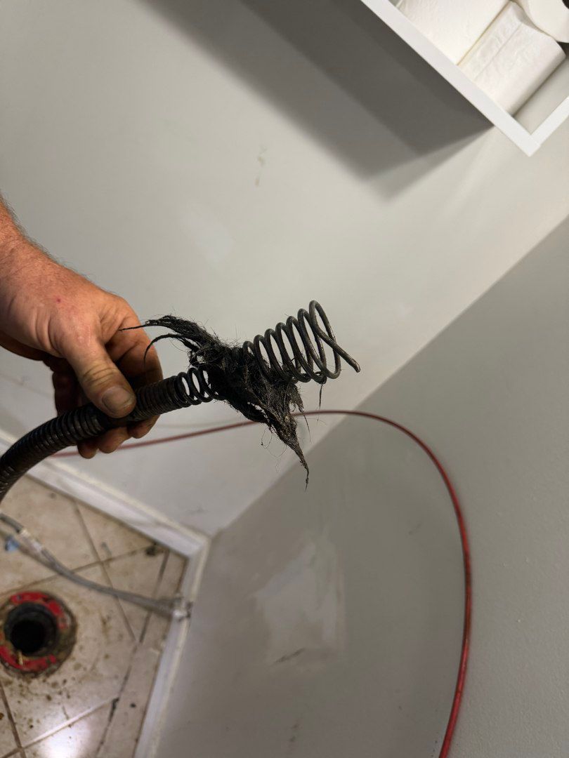 Debris removed from a clogged drain during drain cleaning in Ottawa