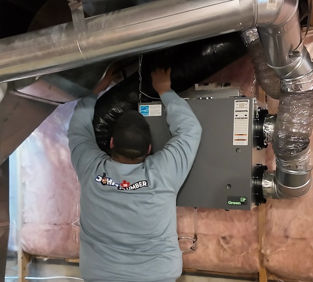 HVAC tech working on a whole-home ventilation