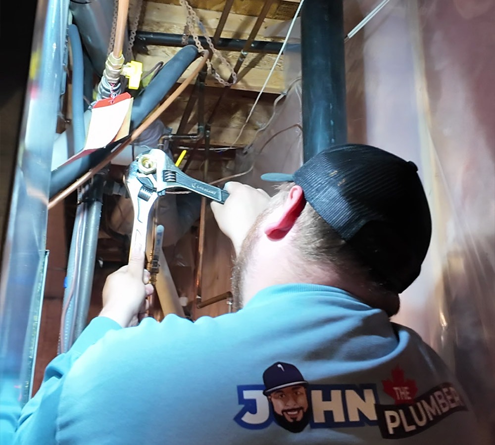 plumber working on gas line