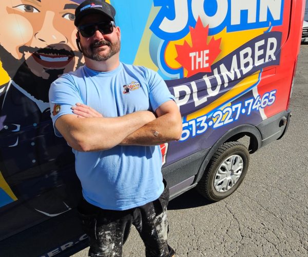 A North York plumber with his John The Plumber van